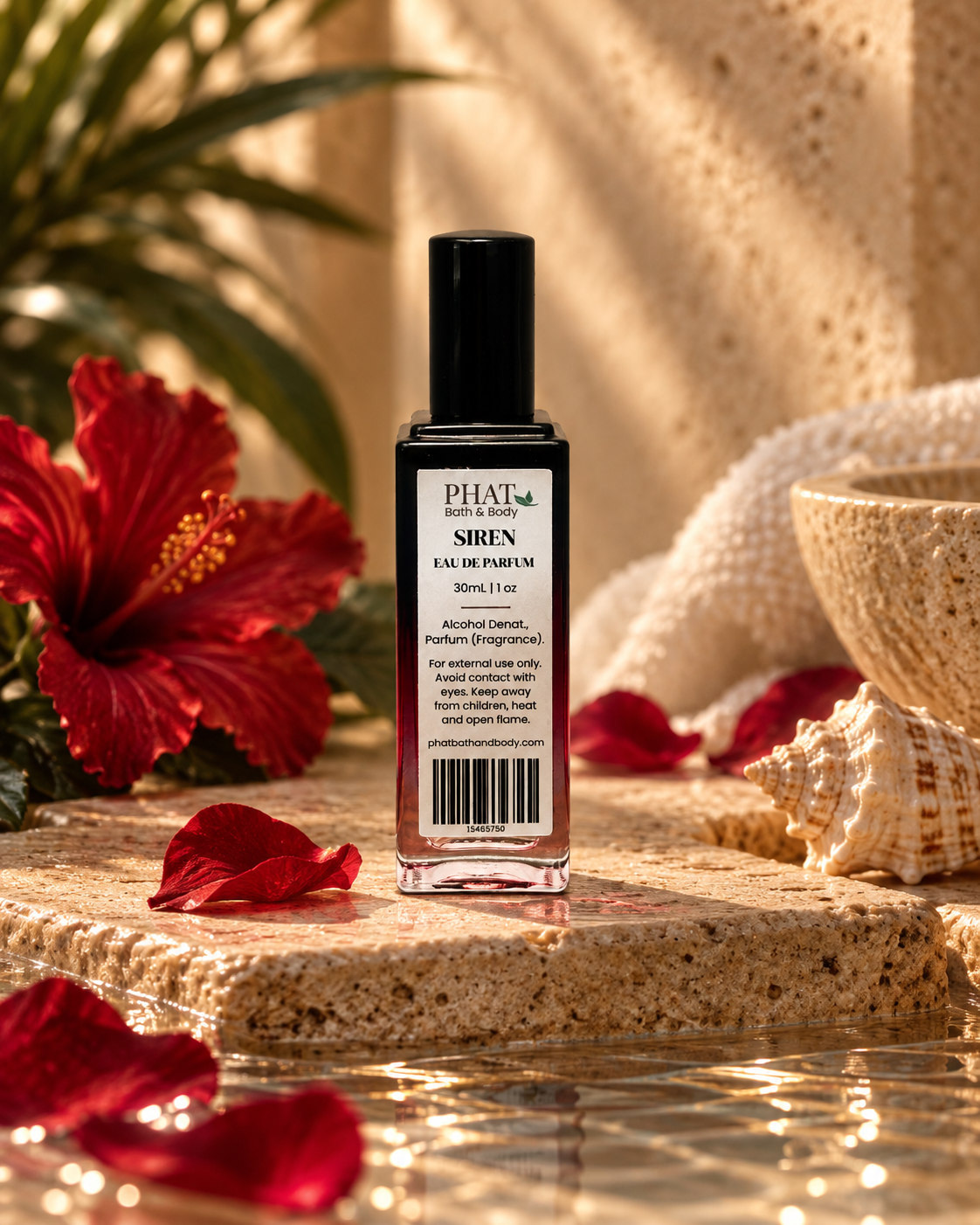 Back label of the Siren women’s Eau de Parfum bottle styled with red florals and warm natural stone.