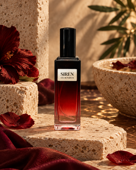 Siren women’s Eau de Parfum bottle in a warm luxury setting with rich red floral accents.