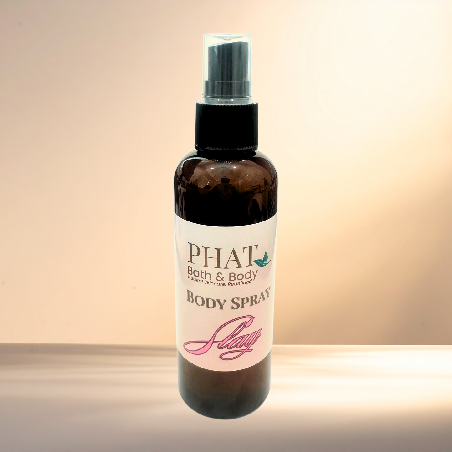 Body spray bottle with 'PHAT Bath & Body' label on a gradient background