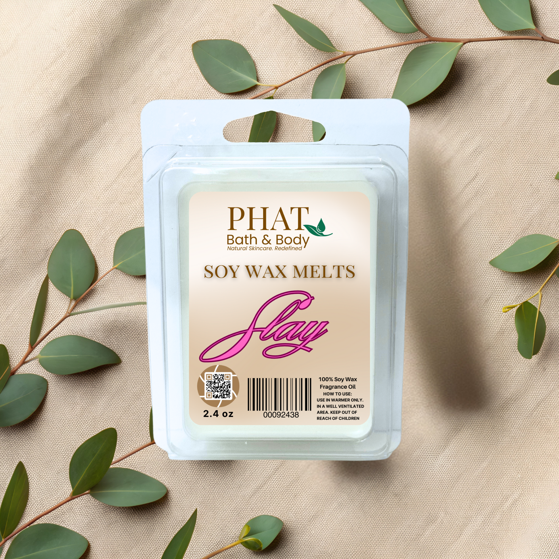 Phat Bath & Body soy wax melts packaging with green leaves on a beige fabric background