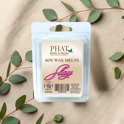 Phat Bath & Body soy wax melts packaging with green leaves on a beige fabric background