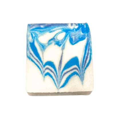 Bar of soap with blue and white marbled pattern on a white background