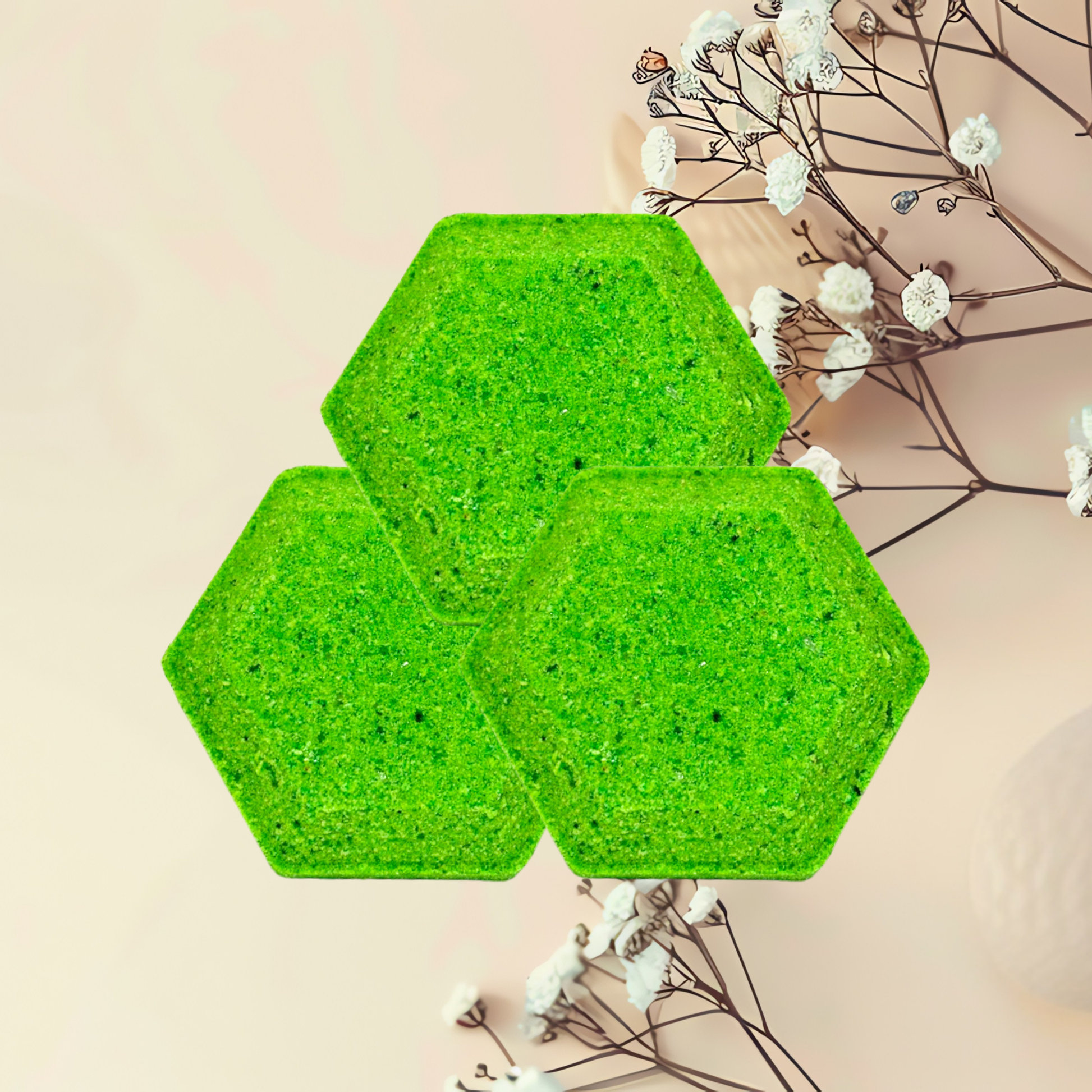Three green hexagonal steamers on a light pink background with white flowers.