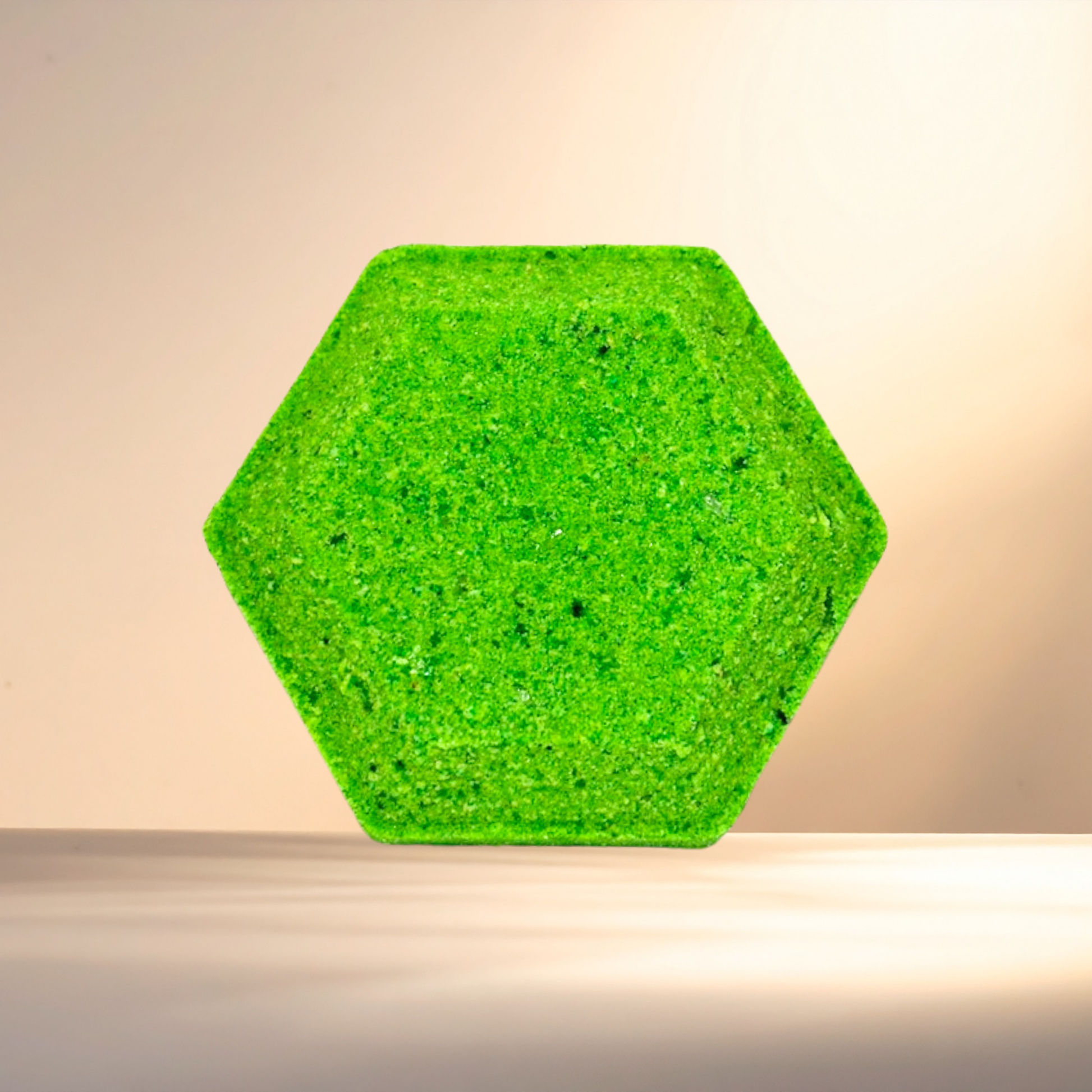 Hexagonal green steamer on a beige background