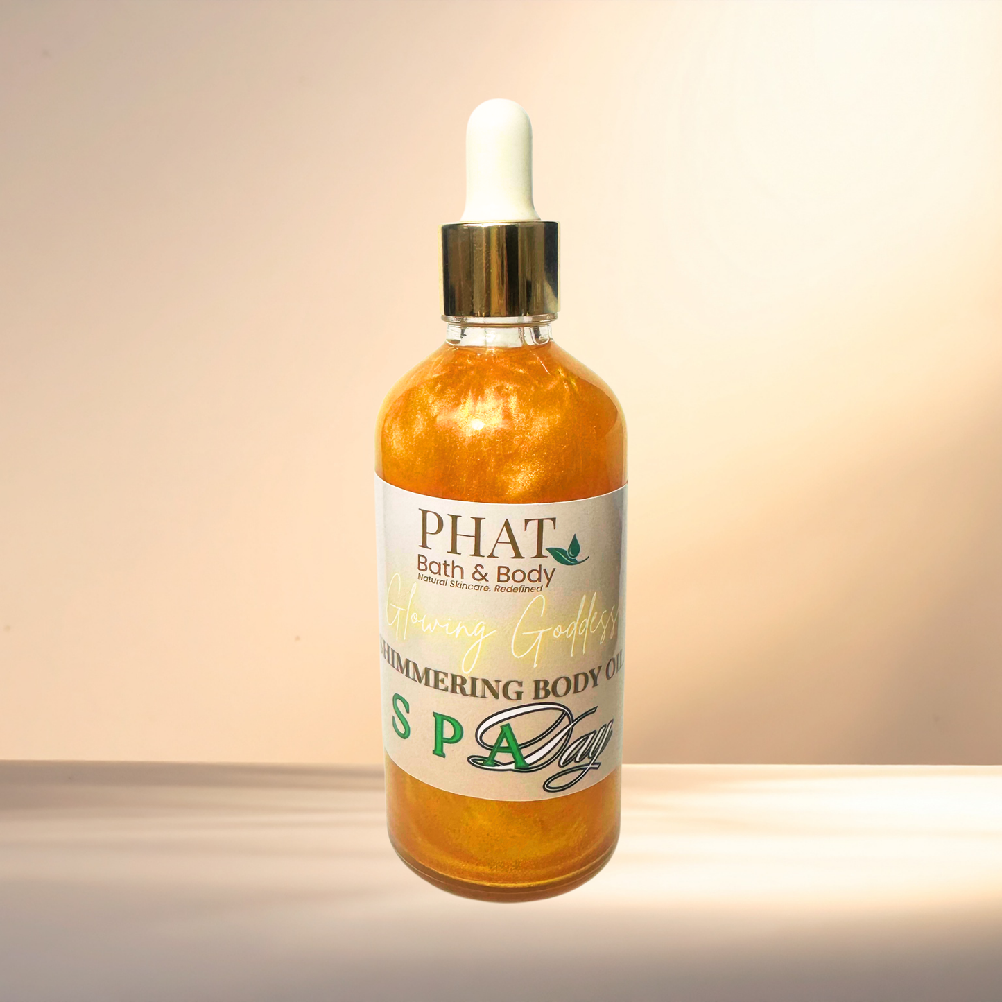 Bottle of PHAT Bath & Body shimmering body oil on a gradient background