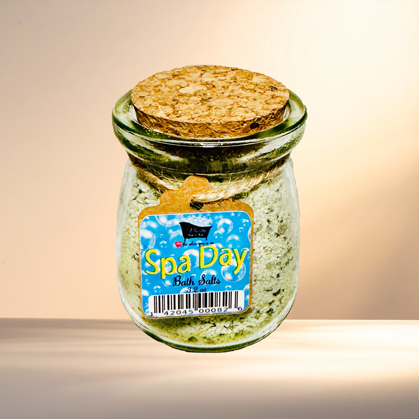 Jar of Spa Day bath salts with a cork lid on a gradient background