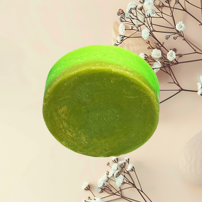 Green soap bar with a natural background