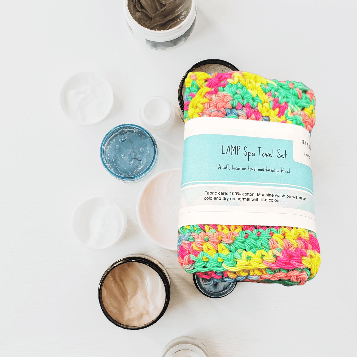 Colorful spa towel set with packaging on a white background