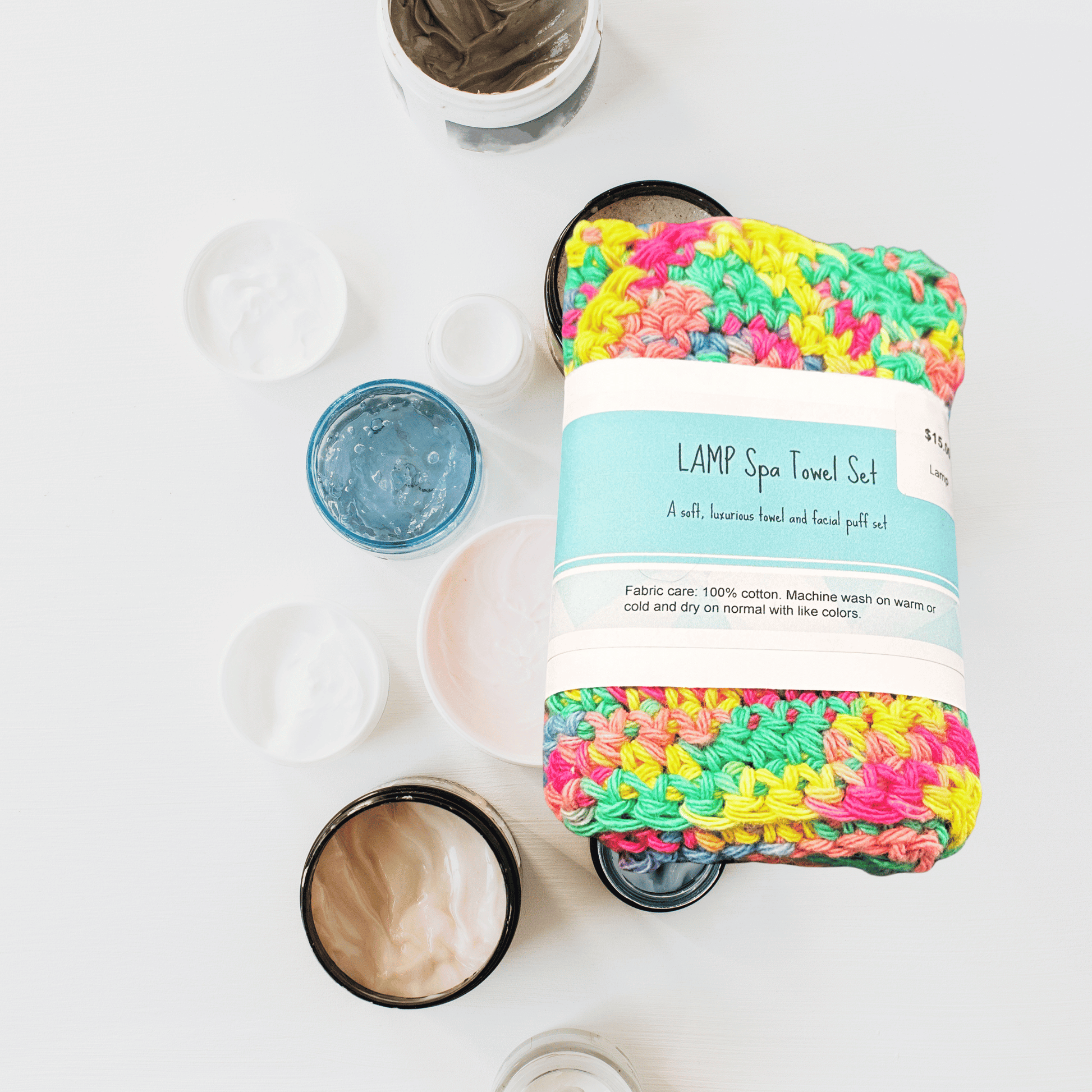 Colorful spa towel set with packaging on a white background