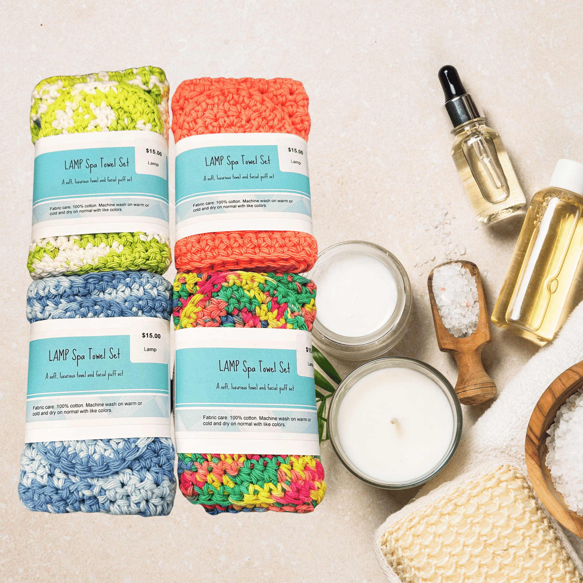 Colorful towel sets with spa items on a neutral background