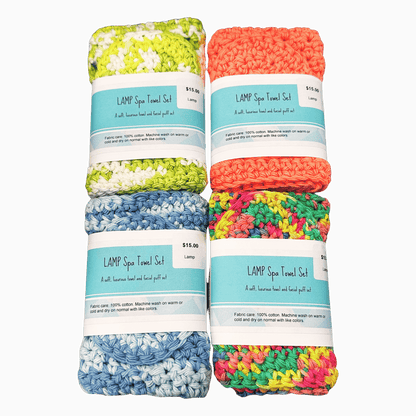 Set of four colorful crocheted towel sets with labels on a dark background