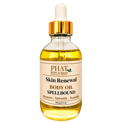 Phat Bath & Body Spellbound Skin Renewal Body Oil, 3.5 oz golden body oil in a clear glass dropper bottle with a gold cap and cream label.