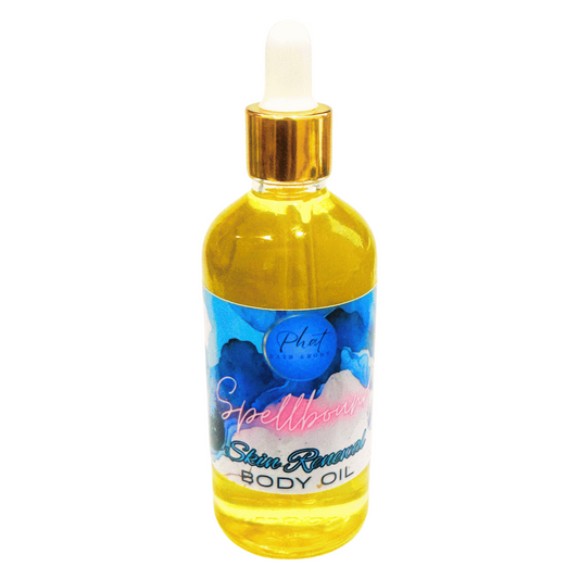 Bottle of Spellbound Skin Renewal Body Oil on a white background