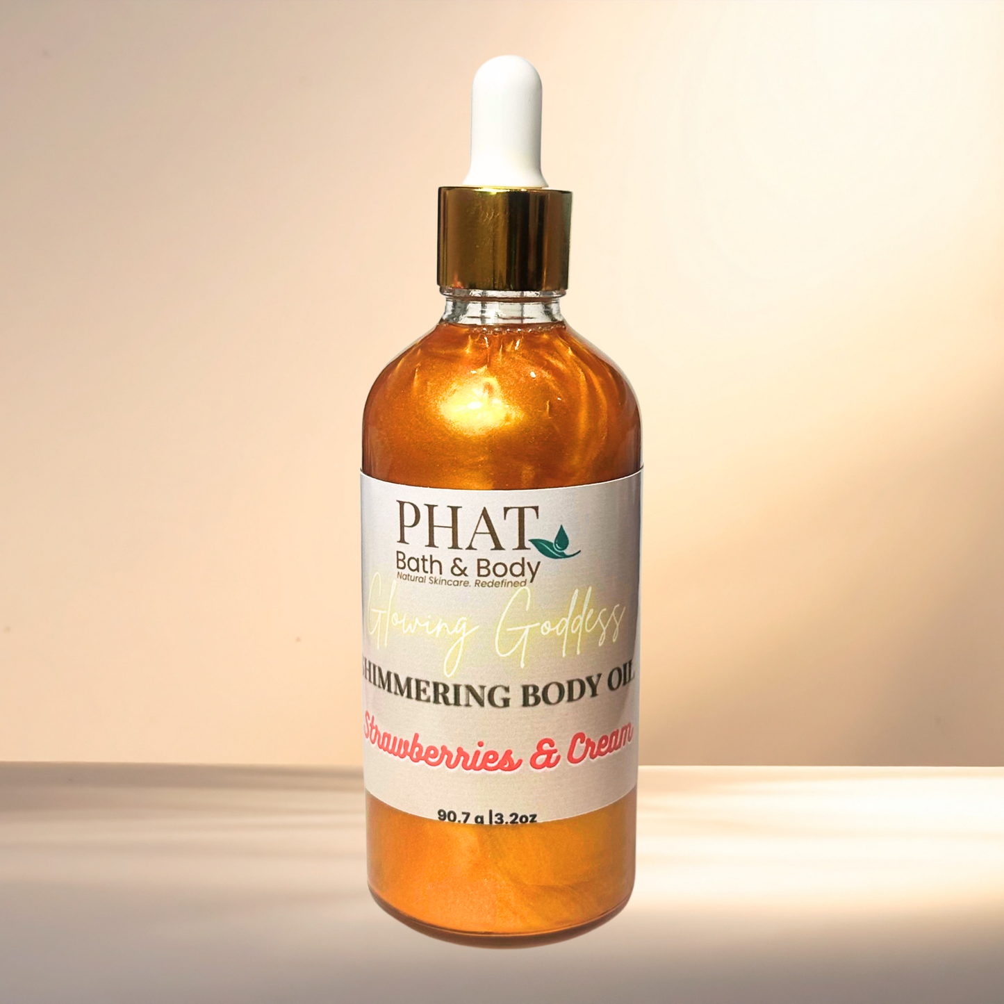 Bottle of PHAT Bath & Body shimmering body oil with a dropper on a gradient background