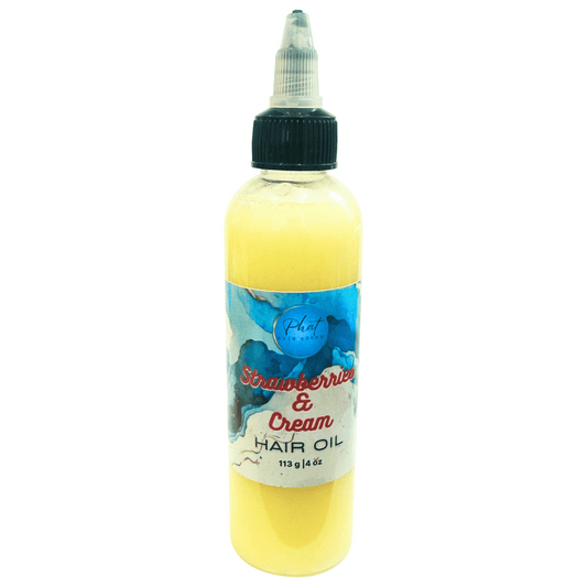 Bottle of strawberry and cream growth hair oil on a white background