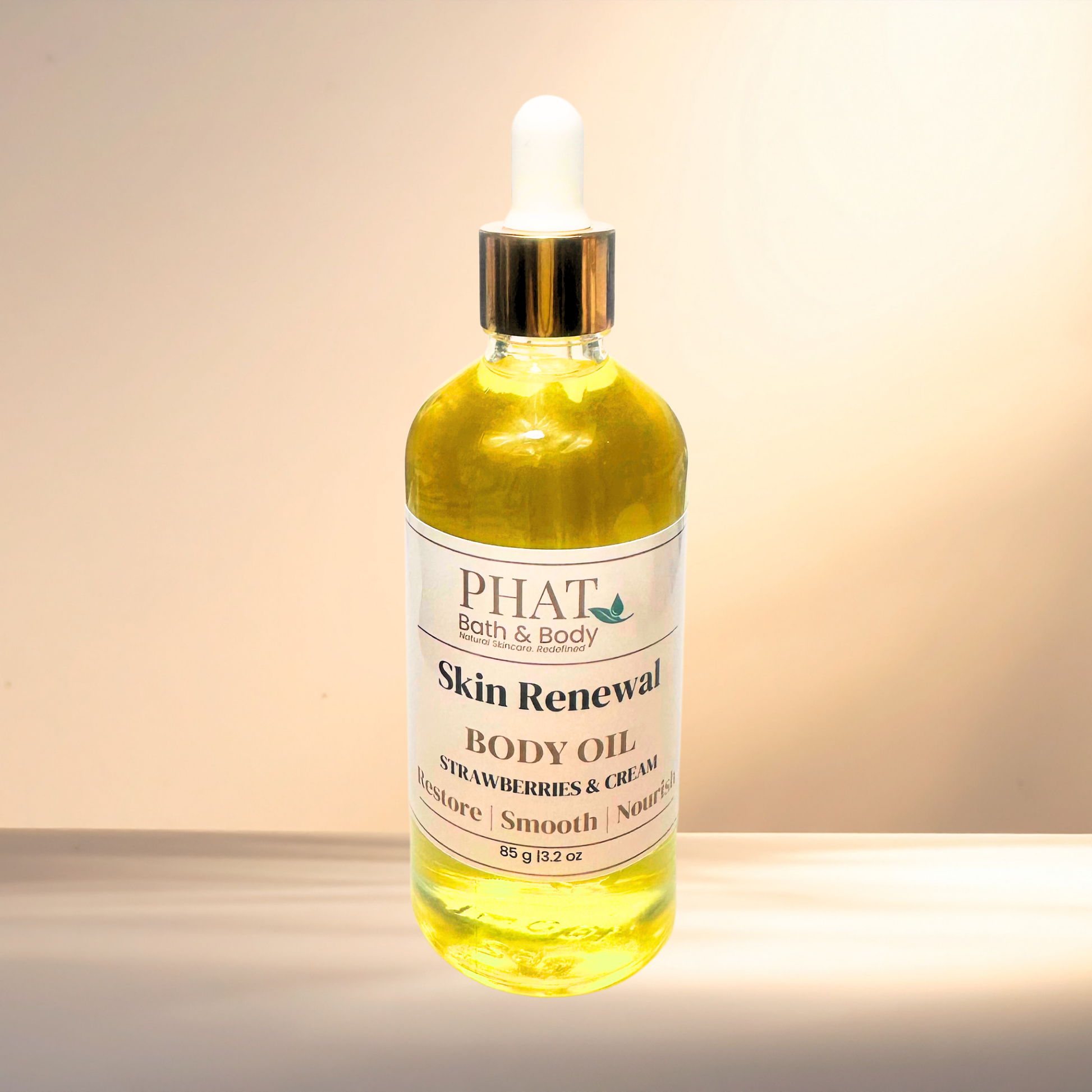Bottle of PHAT Bath & Body Skin Renewal Body Oil on a gradient background