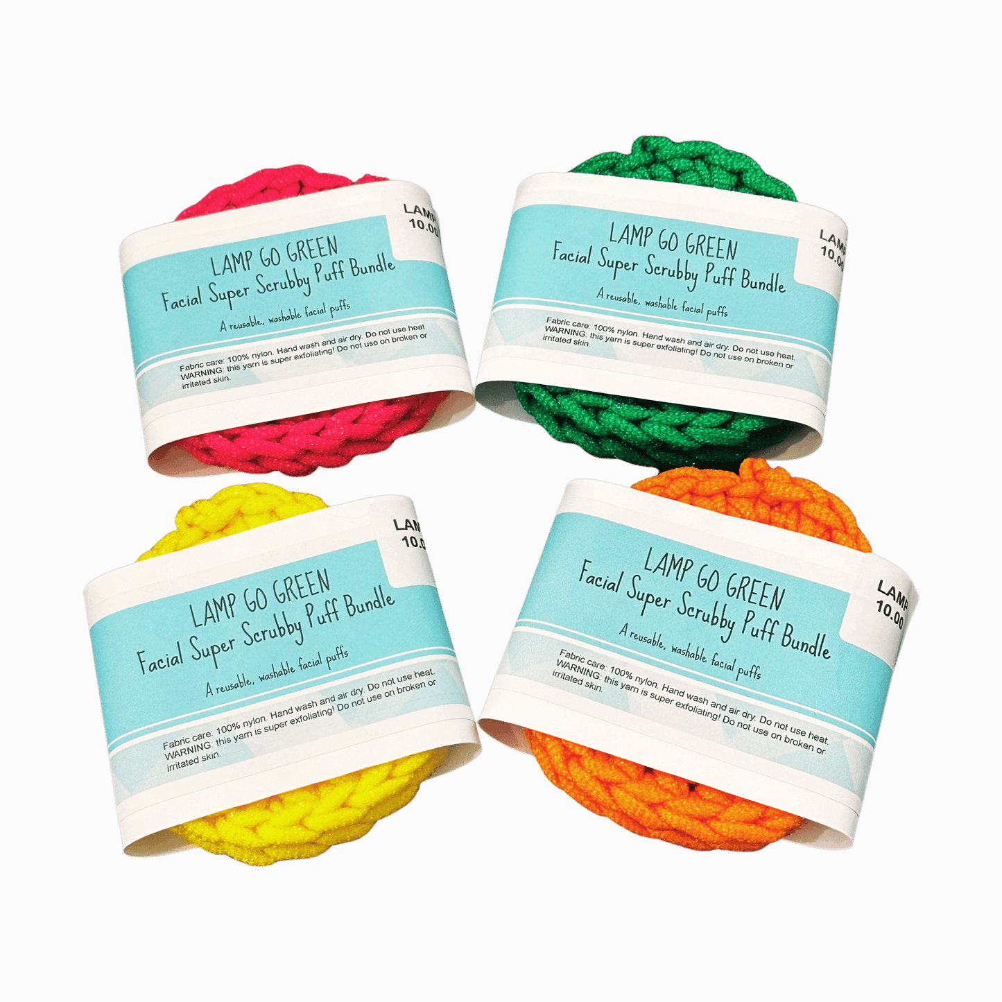 Four colorful facial scrubber puffs with labels on a dark red background