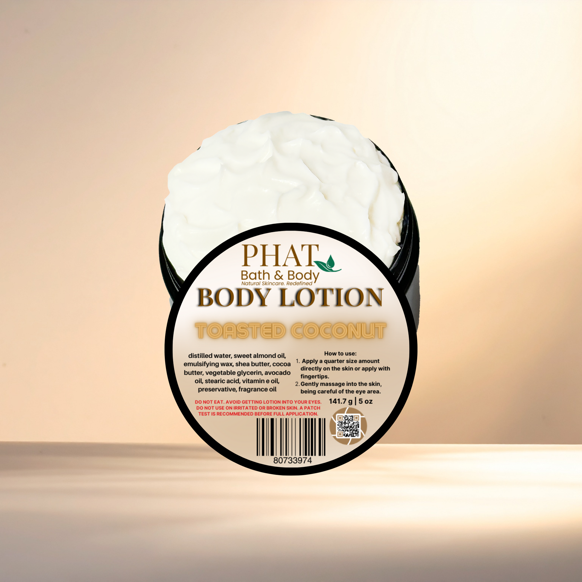 Body lotion container labeled 'Phat Bath & Body Toasted Coconut' on a gradient background