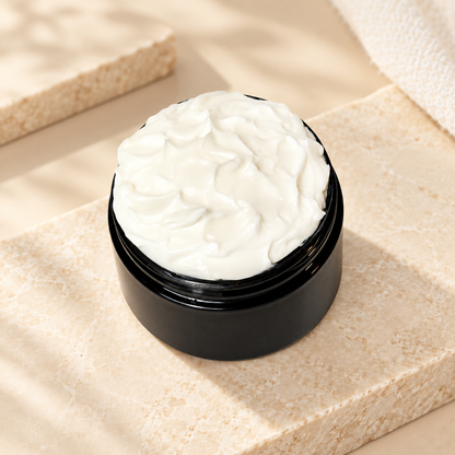 Open jar of Phat Bath & Body Unscented Body Lotion in a clean minimal setting with no fragrance-inspired elements.
