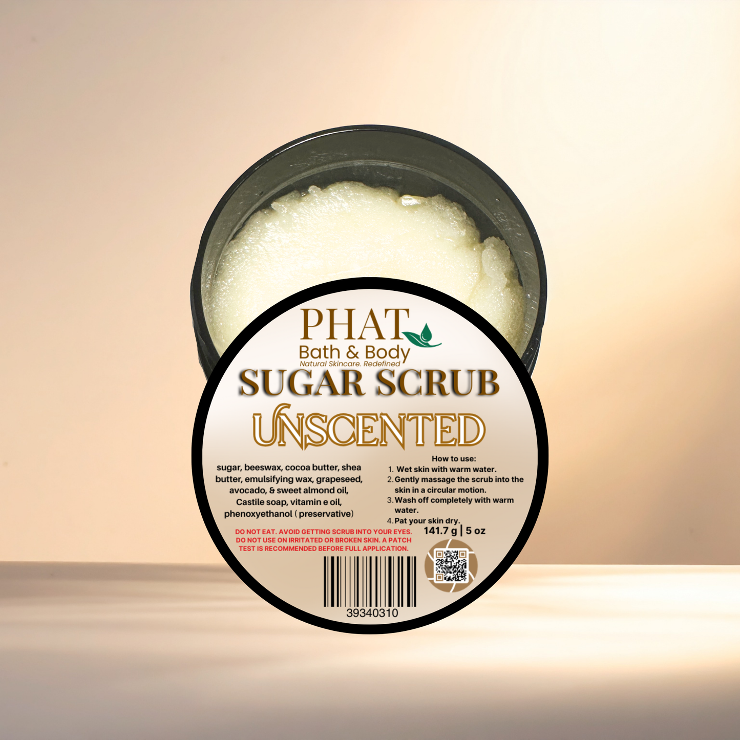 Unscented sugar scrub container with label on a beige background
