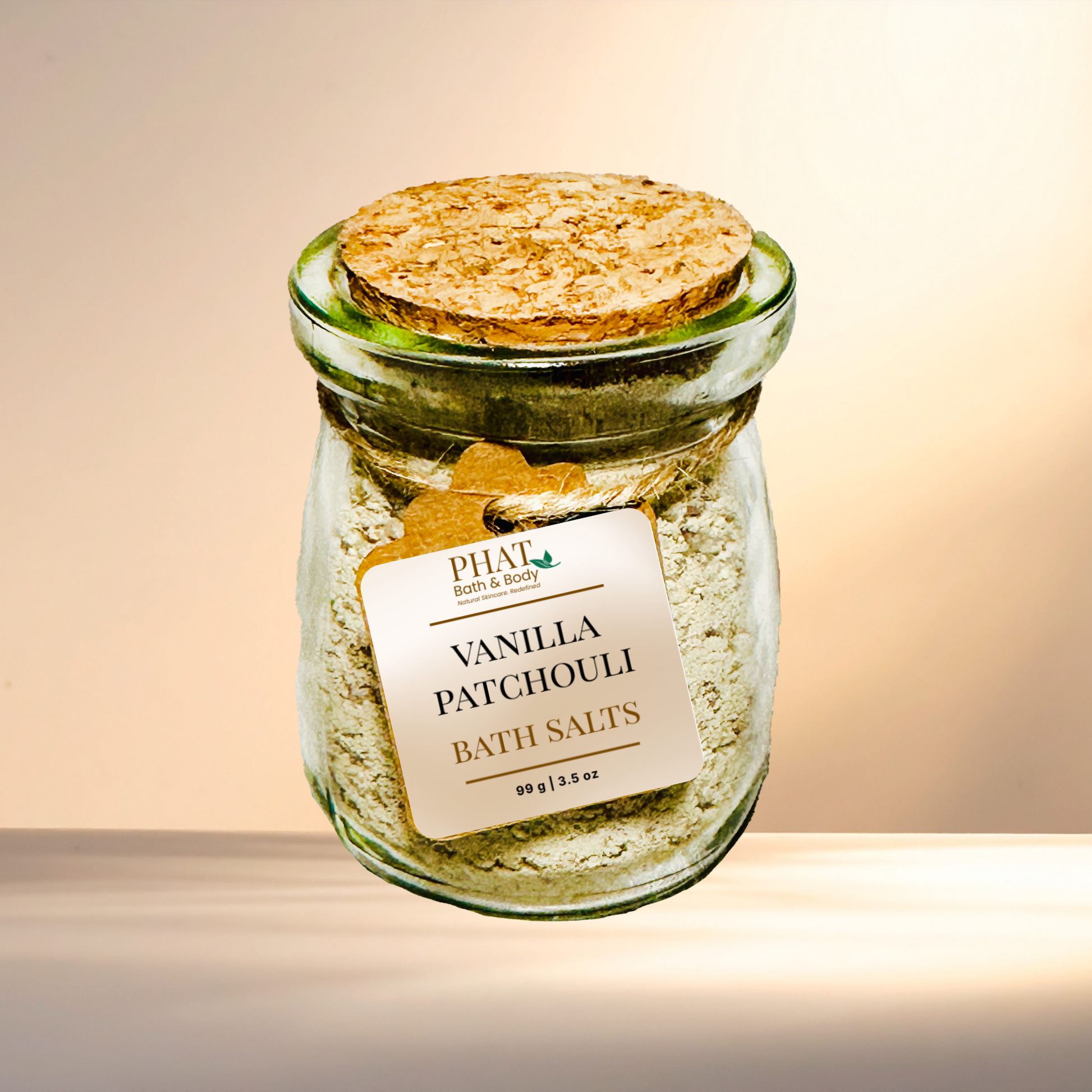 Jar of Vanilla Patchouli bath salts with a cork lid on a gradient background