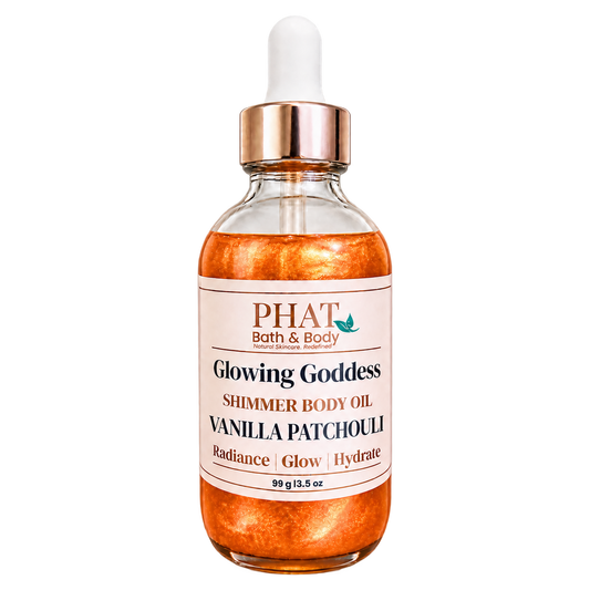 Phat Bath & Body Glowing Goddess Shimmer Body Oil in Vanilla Patchouli, 3.5 oz glass dropper bottle with luminous orange-gold shimmer.