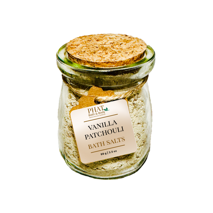 Jar of Vanilla Patchouli Bath Salts with a cork lid on a white background