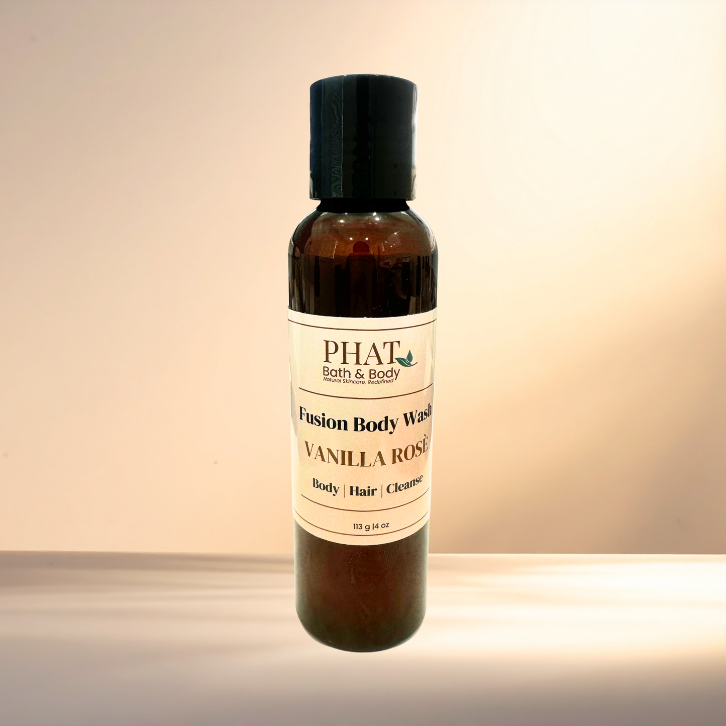 Bottle of PHAT Bath & Body Vanilla Rose Fusion Body Wash on a gradient background