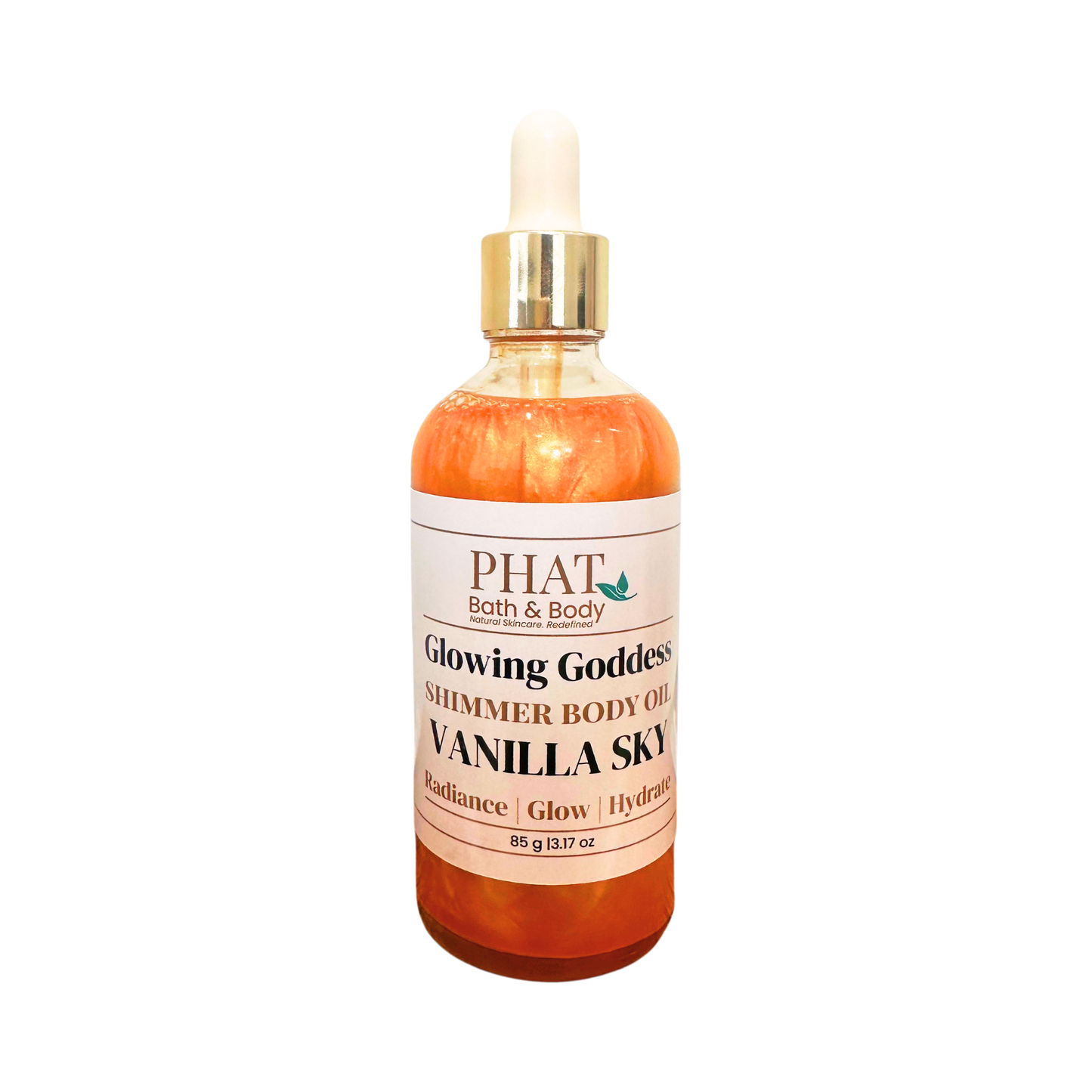 PHAT Bath & Body 'Glowing Goddess' shimmer body oil in a clear bottle with a white dropper cap and gold collar, labeled 'Vanilla Sky' with orange-amber liquid inside, on a white background.