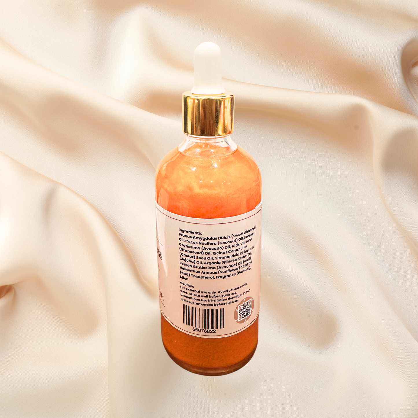 Skincare bottle with label on a beige fabric background