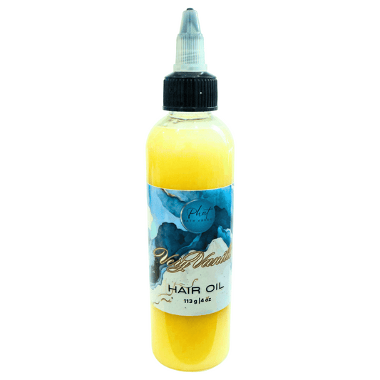 Bottle of Very Vanilla hair growth oil with a blue label on a white background