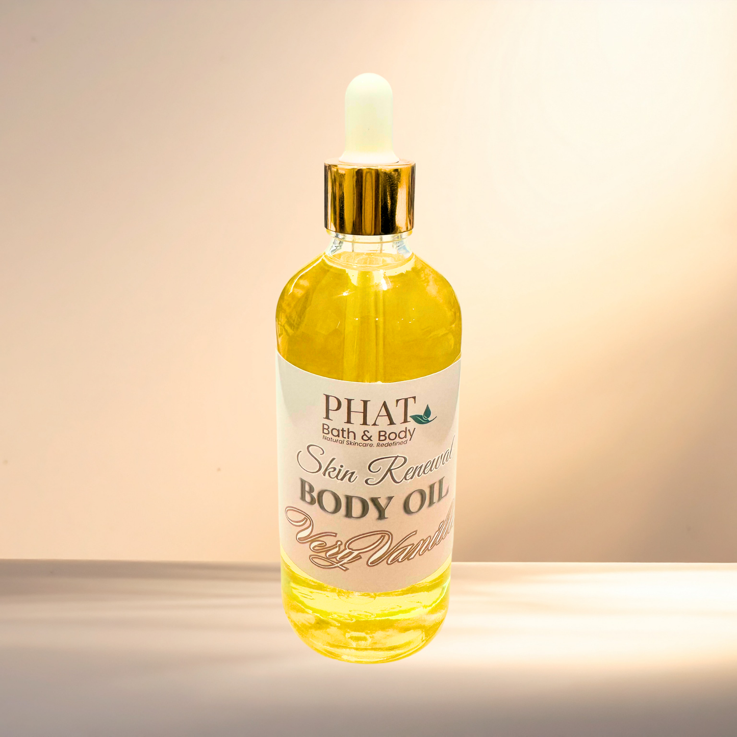 Bottle of PHAT Bath & Body body oil with a dropper on a gradient background
