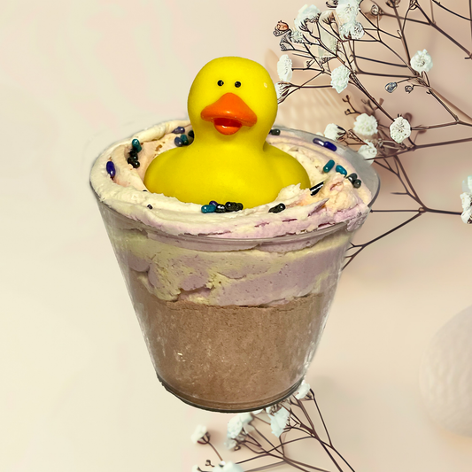 Bubble bomb with a yellow rubber duck on a light background