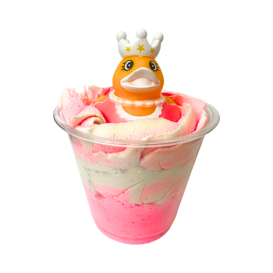 Bubble bomb with a duck toy wearing a crown on a white background