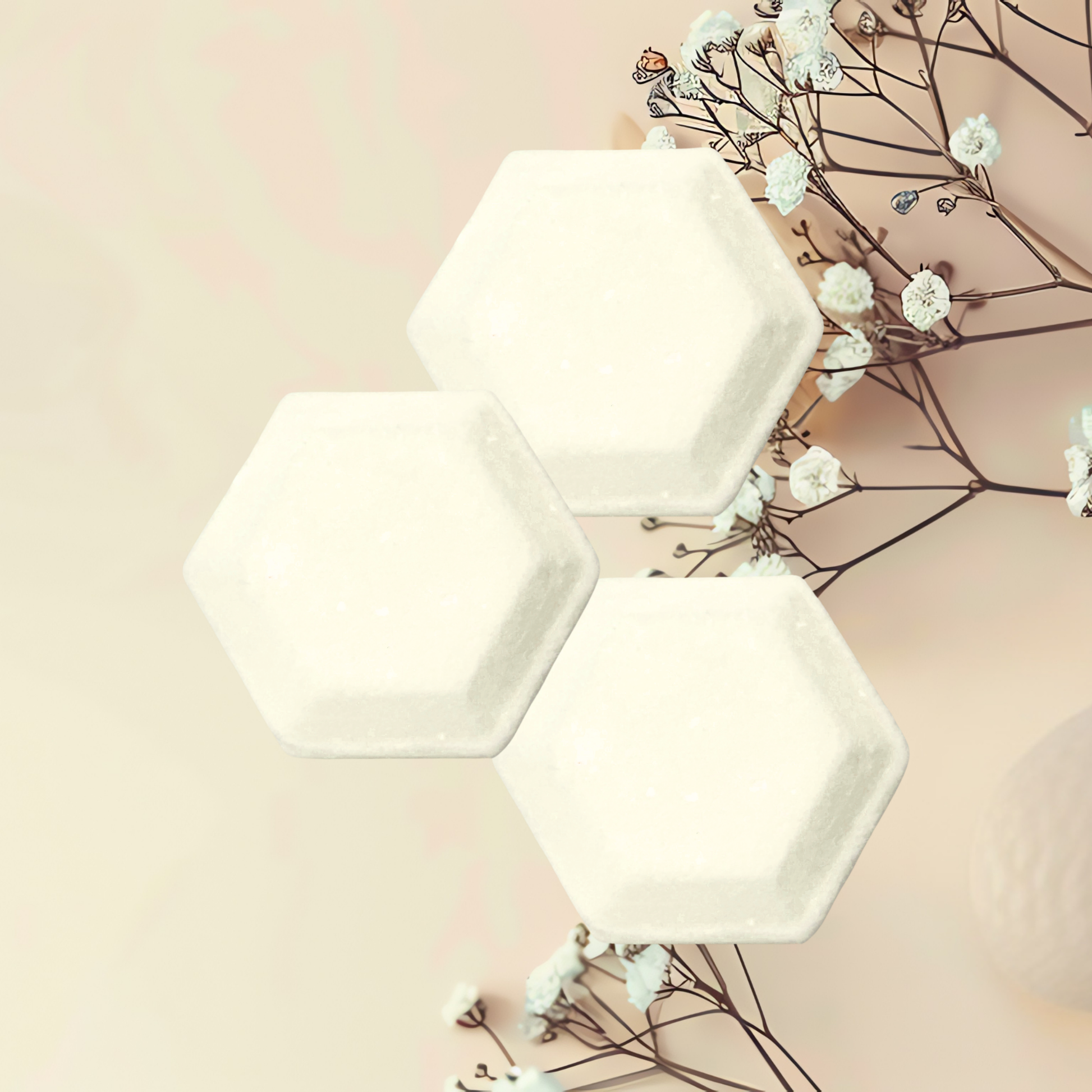 Three white hexagonal steamers on a light pink background with white flowers.