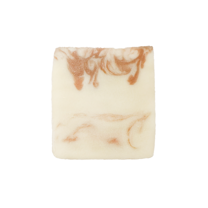 Marbled soap bar with brown and beige swirls on a white background
