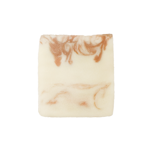 Marbled soap bar with brown and beige swirls on a white background