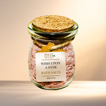 Jar of 'Wish Upon A Star' bath salts with a cork lid on a gradient background