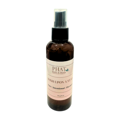 Brown spray bottle with a pink label on a white background