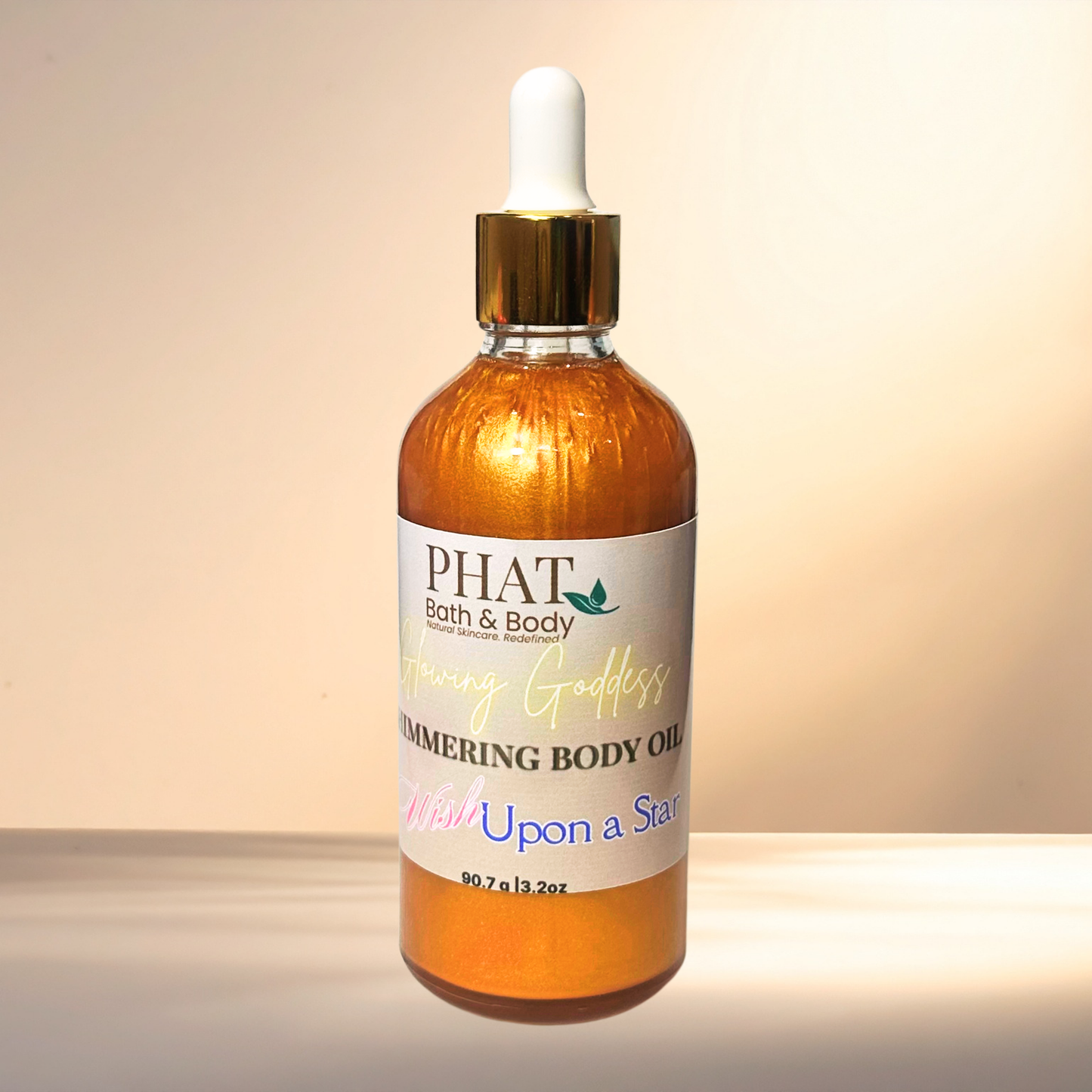 Bottle of PHAT Bath & Body body oil with a dropper on a gradient background