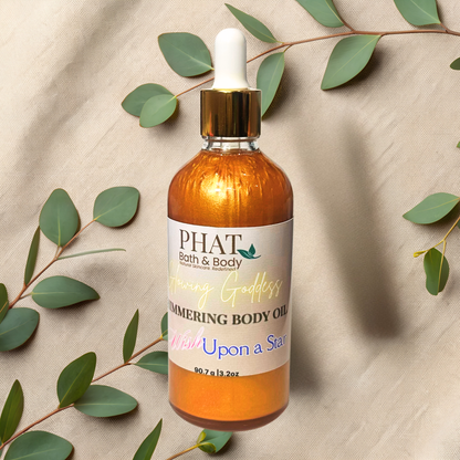 Bottle of PHAT Bath & Body body oil with a dropper on a beige fabric background with green leaves.