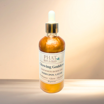 Bottle of PHAT Bath & Body Glowing Goddess Shimmer Body Oil on a gradient background
