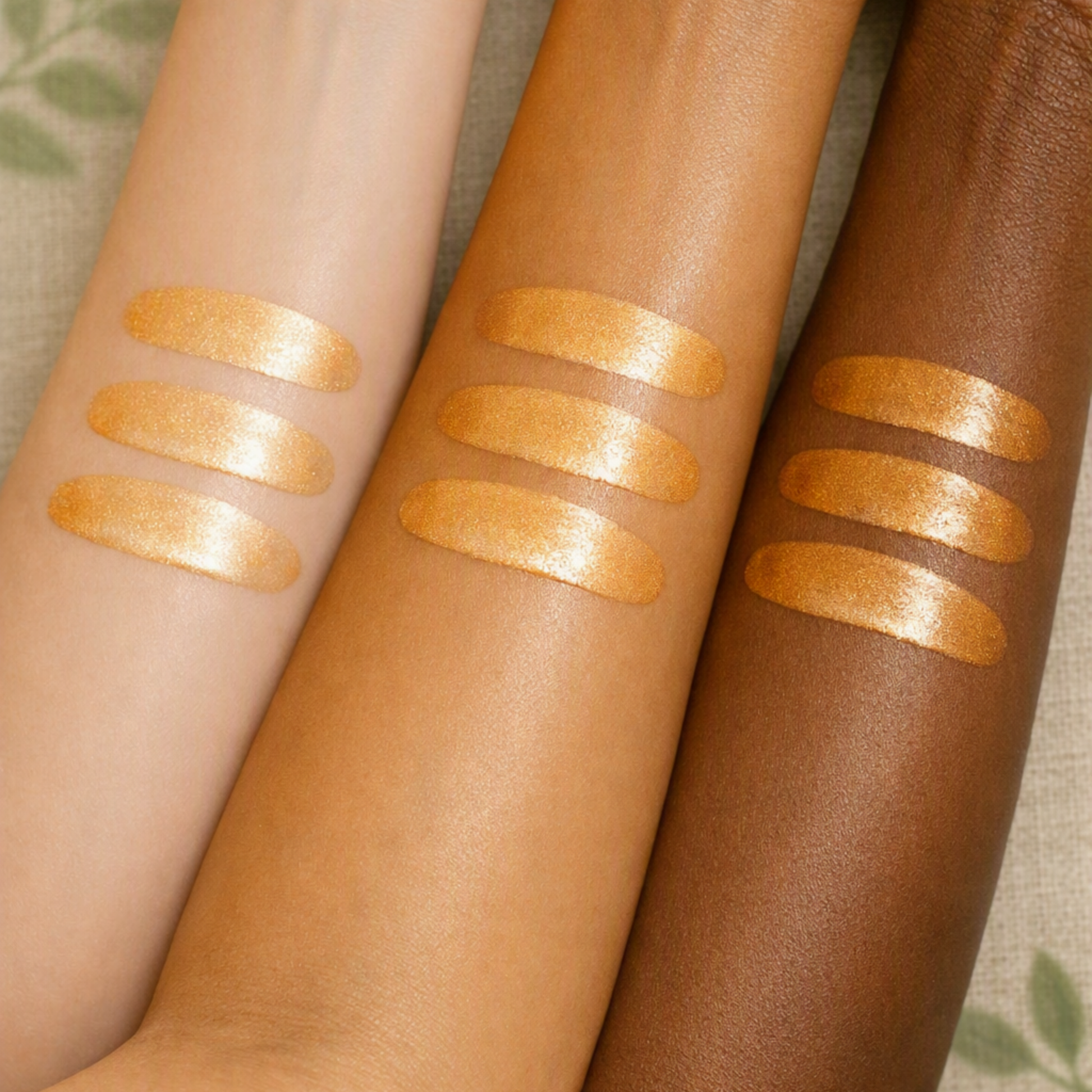 Golden shimmer body oil shown on multiple skin tones to demonstrate its luminous finish.